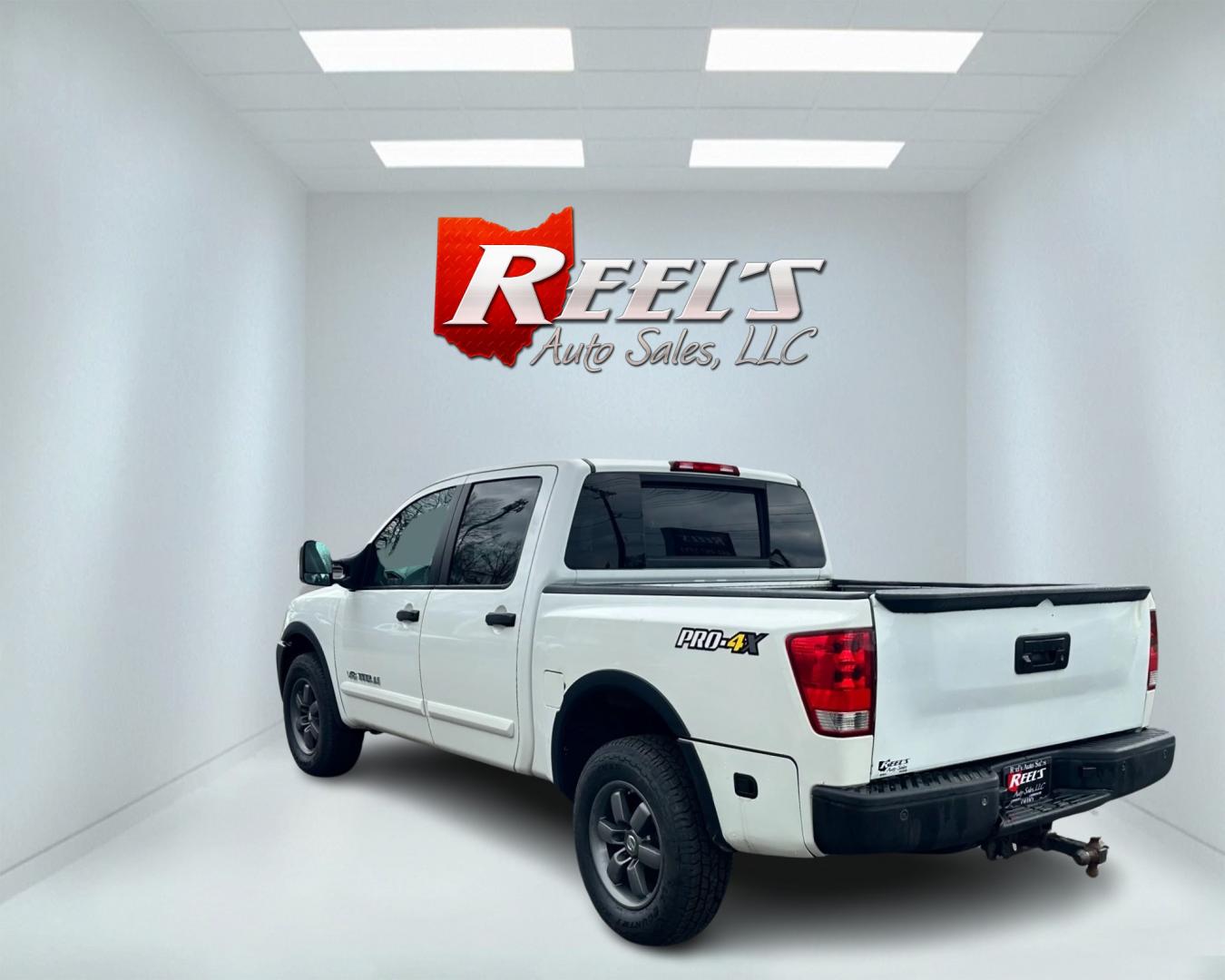 2013 White /Black Nissan Titan Pro-4X (1N6AA0EC0DN) with an 5.6L DOHC 32V V8 engine, Automatic transmission, located at 547 E. Main St., Orwell, OH, 44076, (440) 437-5893, 41.535435, -80.847855 - This 2013 Nissan Titan Pro-4X Crew Cab is a capable and well-equipped full-size pickup truck. It features a powerful 5.6L Endurance V8 engine paired with a 5-speed automatic transmission, a locking rear differential for improved traction, and a maximum towing capacity of 9,300 pounds. The truck is l - Photo#5